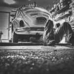 Mechanic reviewing a transmission replacement estimate at an auto repair counter